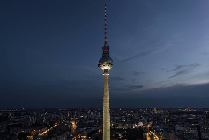 Radiant TV tower at night | Unsplash: Artem Sapegin